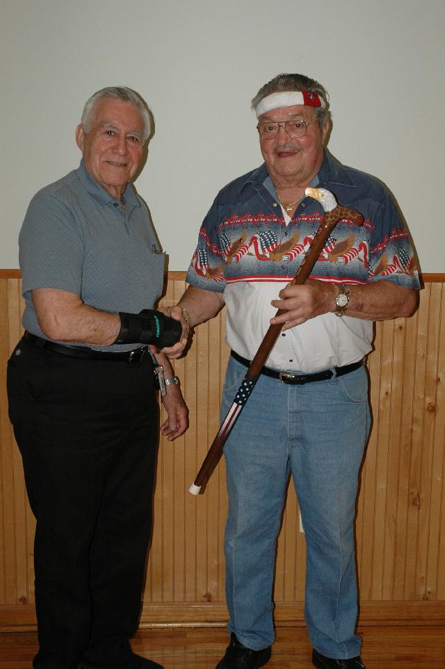 Navy Ernest Bierbaum (right). Presented by Joe Palmeri of HVWC. Cane carved by Hal Weisel of HVWC.