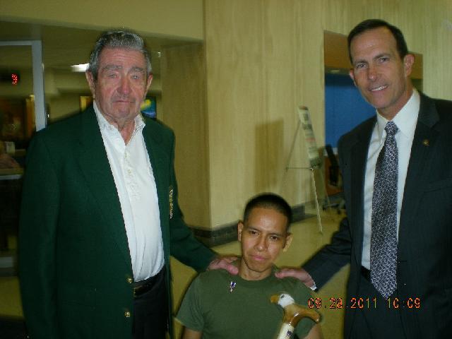 Marine CPL Luis Remache. Presenteb By MG Victor Hugo Jr. and MG Robert Worley. Cane carved by Donald Fenner of MVA&WA.