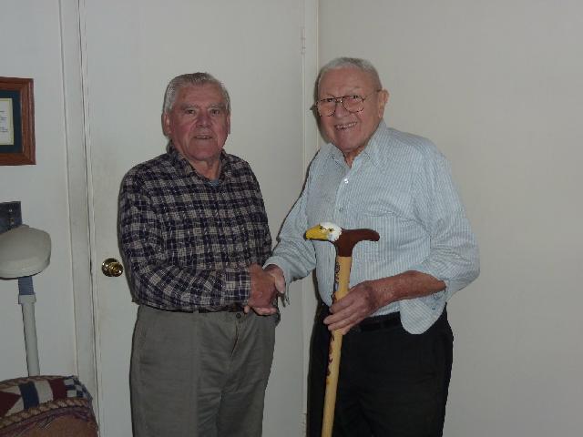 Army, Primo Calabrese. Presented by Eric Sund (left). Cane carved by Eric Sund of HVWC.