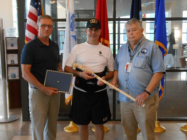 Army CW2 Stephen Gilmore. Cane carved by Bill Johnson of MVA&WA. Presentation to CW2 Stephen Gilmore (center), by left Harry Monahan USMC and right Jack Berkut NVCA.
